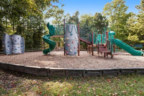 a playground with a slide in a park at Sea Colony - 4003 Volley in Bethany Beach