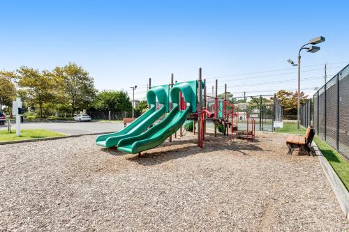 a playground with a slide in a park at Sea Colony - 4003 Volley in Bethany Beach