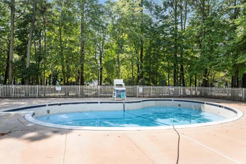 a small pool in a yard with a fence at Sea Colony - 4003 Volley in Bethany Beach
