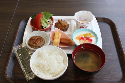 a tray of food with rice and other foods on it at Henn na Hotel Premier Tokyo Asakusa Tawaramachi in Tokyo