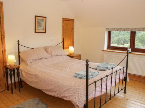 เตียงในห้องที่ Minton Lane Cottage