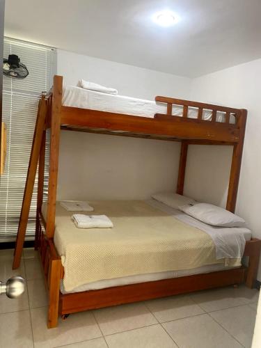 two bunk beds in a small room with at GUADUALES DEL CAFÉ B-409 in Montenegro