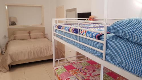 a small bedroom with a bunk bed and a crib at L157 Cabopino in Marbella