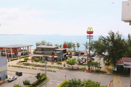 a view of a parking lot with a mcdonalds sign at PD D’Wharf Amazing Seaview Suite 9 (Up to 6 Pax) in Port Dickson