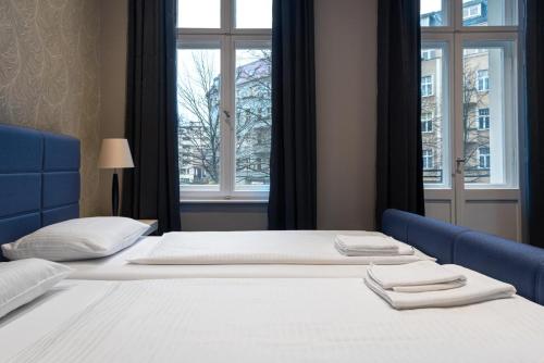 Postel nebo postele na pokoji v ubytování Hotel Gasteiner Hof