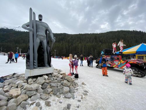 a group of people standing around a statue at CEDAR LODGE NEXT TO LIFT ONE BEDROOM APARTMENT in Bansko