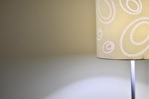 a close up of a lampshade in a room at Motel L'Abri in Carleton sur Mer
