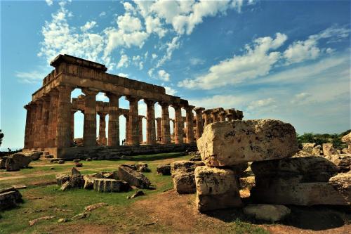 an ancient building with columns in a field at La dimora di Clara in Trapani