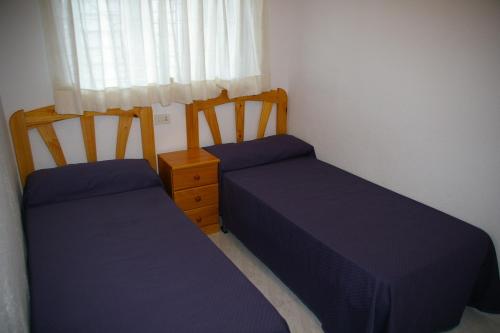 A bed or beds in a room at Apartamento Princicasim 2 dormitorios