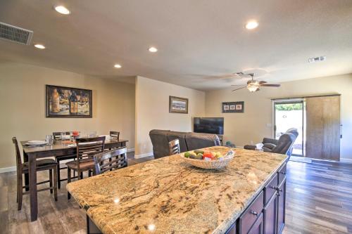 a kitchen and living room with a table and chairs at 15 Mi to Dtwn Avondale Home with Pool and Yard in Avondale