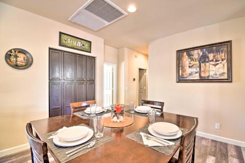 a dining room with a wooden table and chairs at 15 Mi to Dtwn Avondale Home with Pool and Yard in Avondale
