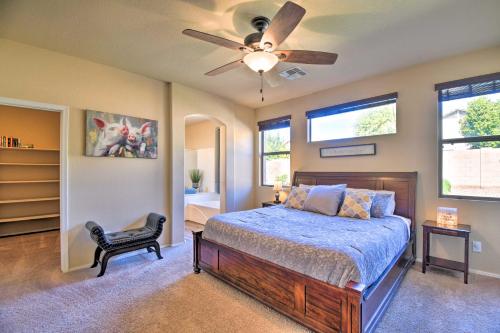 a bedroom with a bed and a ceiling fan at 15 Mi to Dtwn Avondale Home with Pool and Yard in Avondale