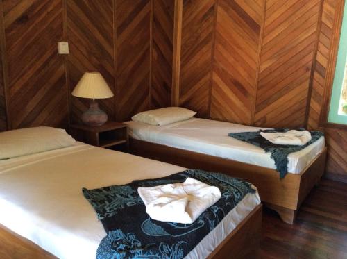 Postel nebo postele na pokoji v ubytování Villas de la Bahia Playa Tambor
