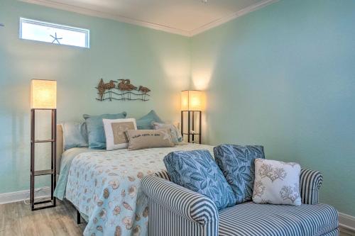 a bedroom with a bed and a couch and a window at Furnished Deck + Ocean Views: Surfside Beach Home in Surfside Beach