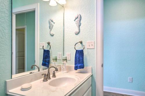 a bathroom with a sink and a mirror at Furnished Deck + Ocean Views: Surfside Beach Home in Surfside Beach