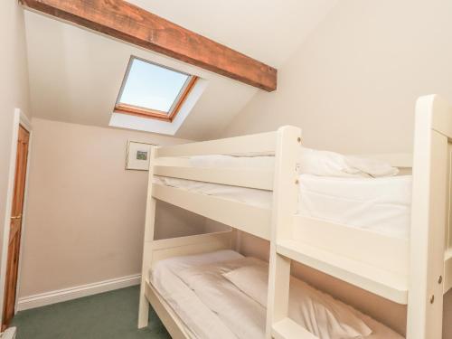 a bedroom with bunk beds in a attic at Hadrian's View in Brampton