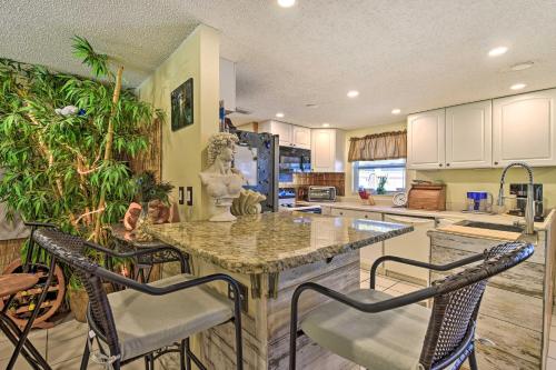 a kitchen with a table and chairs in a room at Unique Nokomis Home about 2 Mi to Beach Access! in Nokomis