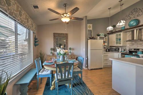 a kitchen and dining room with a table and a refrigerator at Flagstaff Condo Less Than 1 Mi to Golfing and Hiking! in Flagstaff