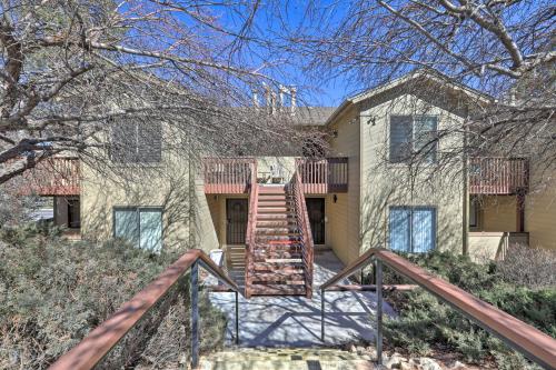 a house with a staircase in front of it at Flagstaff Condo Less Than 1 Mi to Golfing and Hiking! in Flagstaff