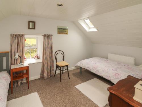 Tempat tidur dalam kamar di Limestone Cottage