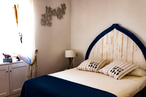 Ένα ή περισσότερα κρεβάτια σε δωμάτιο στο Casa Argo Navis