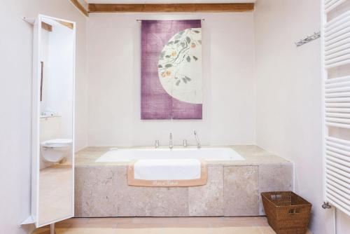 a bathroom with a large sink and a toilet at Villa charmante à Dunes avec piscine privée in Dunes