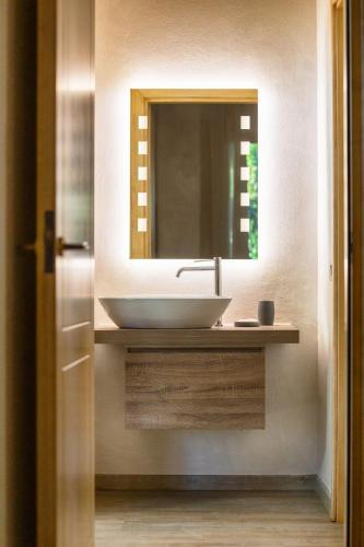 a bathroom with a sink and a mirror at Baba Residences in Alassio