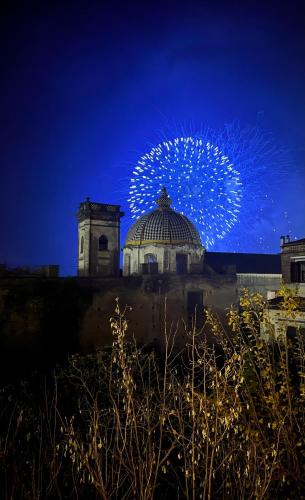 a fireworks display in the sky over a building at Accademia 39 in Sorrento