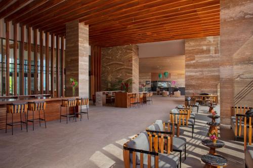 a rendering of a restaurant with tables and chairs at Secrets Bahia Mita Surf and Spa - All Inclusive - Adults Only in Punta Mita