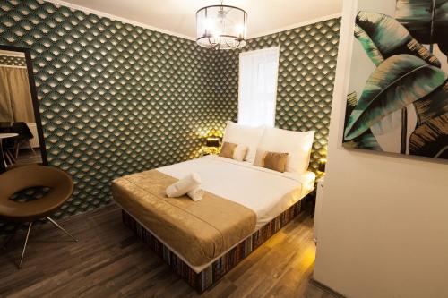 Llit o llits en una habitació de Classy Boutique