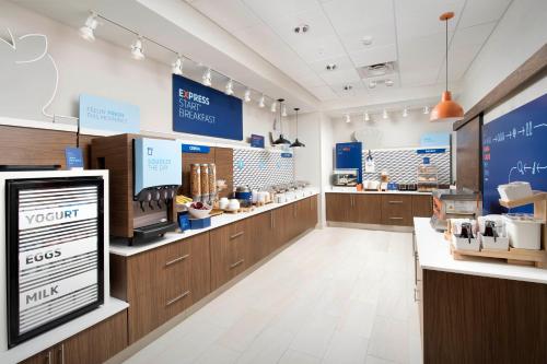 a store with wooden counters and a counter top at Holiday Inn Express & Suites Central Omaha by IHG in Omaha