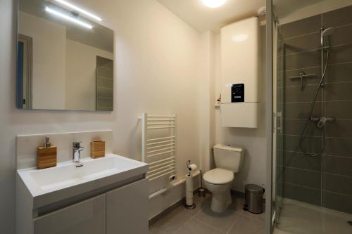 a bathroom with a sink and a toilet and a shower at The Timeless - Balzacien in Tours