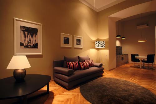 a living room with a couch and a table at Gateway Budapest City Center in Budapest