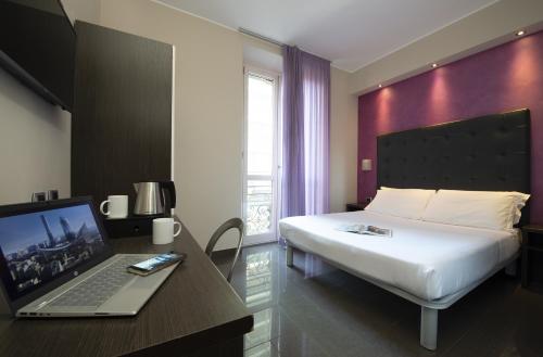Кровать или кровати в номере Hotel Five