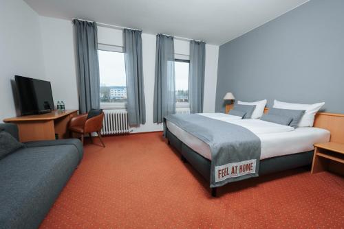 Postel nebo postele na pokoji v ubytování Coffee Fellows Hotel Trier