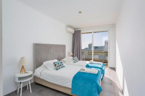 Cama ou camas em um quarto em Old Town Beach Apartments