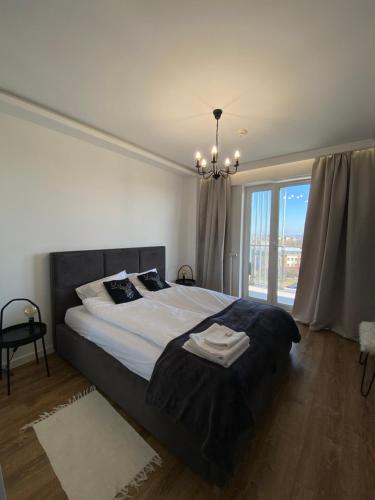 Кровать или кровати в номере SunRise Apartament