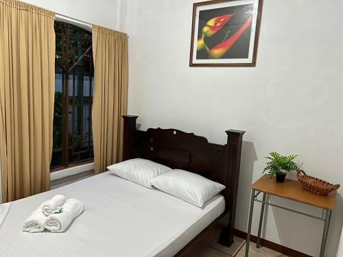 Ένα ή περισσότερα κρεβάτια σε δωμάτιο στο Natural Experience House