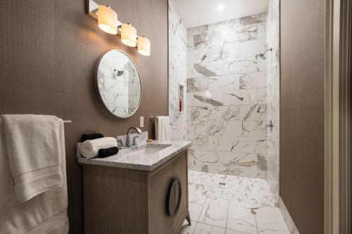 a bathroom with a sink and a shower at The Edward Buffalo in Buffalo