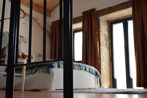 Ένα ή περισσότερα κρεβάτια σε δωμάτιο στο Casa das Andorinhas