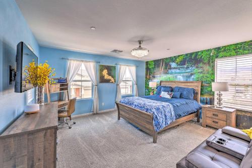 a bedroom with blue walls and a bed with a blue bedspread at Luxurious Henderson Home 16 Mi to The Strip! in Las Vegas