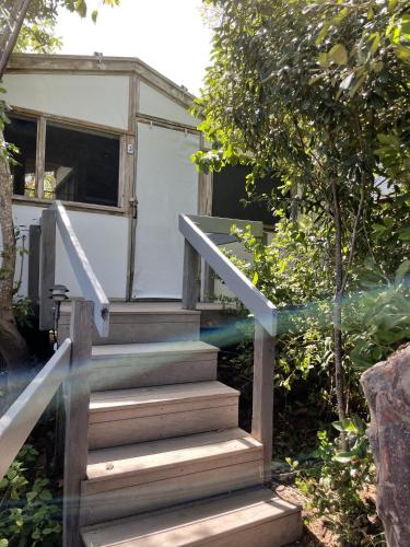 a set of stairs leading to a tiny house at Virgin Islands Campground in Water Island