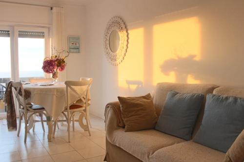a living room with a couch and a table at Beachy 2Bdrm in Santa Cruz w/ stunning Ocean View! in Santa Cruz