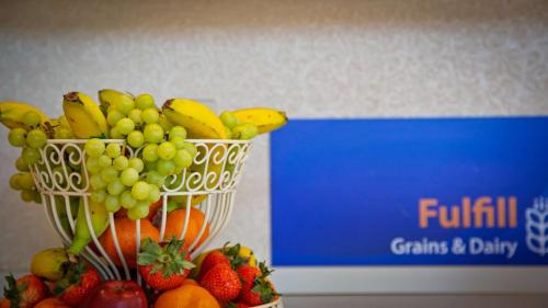 a bunch of fruit in a vase on a table at Best Western Fredericksburg in Fredericksburg