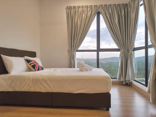 מיטה או מיטות בחדר ב-Bell Family Suite @Sepang Kota Warisan KLIA
