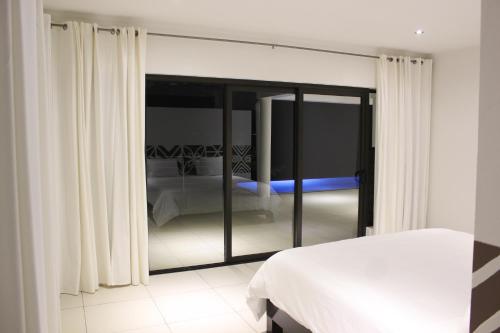Postel nebo postele na pokoji v ubytování Sapphire Bay Fiji