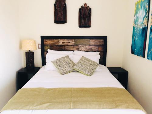 Cama ou camas em um quarto em HOTEL TEKAPA