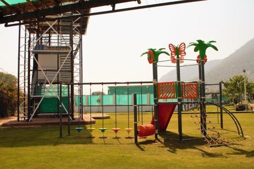 a playground with a swing set in a park at Shivir Aranya - Wilderness Resort in Alwar