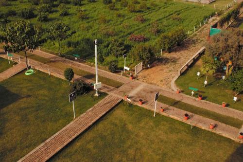 an overhead view of a park with trees and grass at Shivir Aranya - Wilderness Resort in Alwar