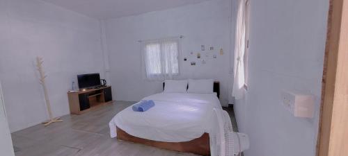 Postel nebo postele na pokoji v ubytování Mycoffeepanghai